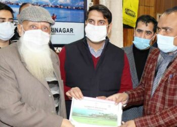 Div Com, DC Srinagar hand over Land Passbooks to owners