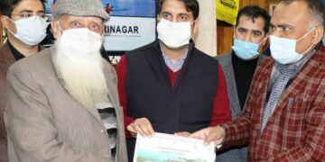 Div Com, DC Srinagar hand over Land Passbooks to owners
