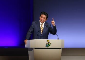 Tokyo stocks close slightly higher, gains capped by Abe shooting