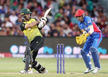 Australia survive Rashid Khan cameo in four-run win