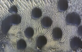 NASA spacecraft captures unusual circles of sand dunes on Mars
