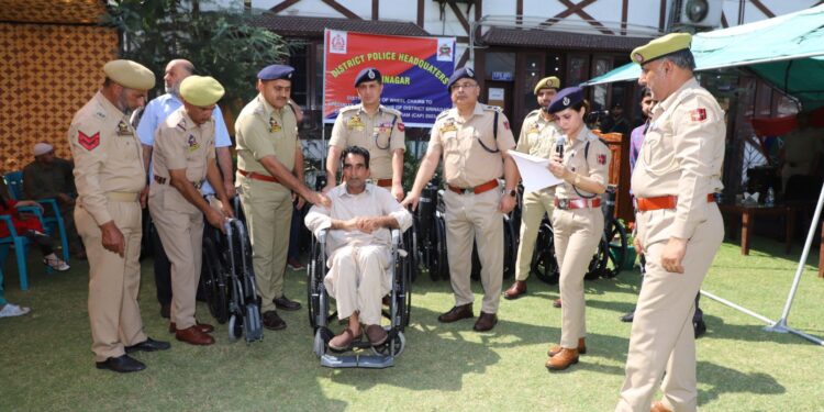Police distributes wheelchairs among specially-abled persons in Srinagar