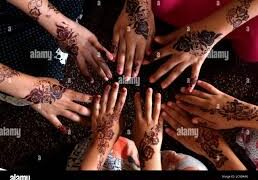 Women embellish hands with Henna ahead of Eid