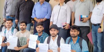 Director SDD hands over offer letters to selected candidates during placement fair