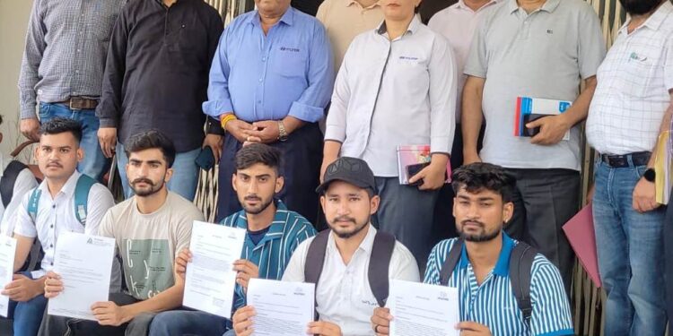 Director SDD hands over offer letters to selected candidates during placement fair