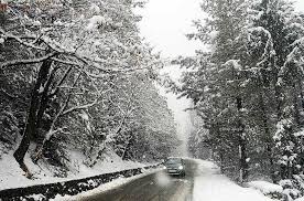 Snow blankets Kashmir parts, rains lash plains