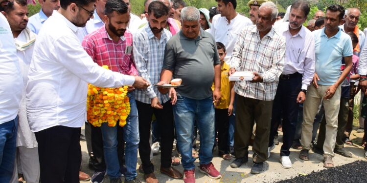 Minister Satish Sharma Inaugurates Key Road Projects, Distributes Relief Kits, and Felicitates Meritorious Students in Akhnoor