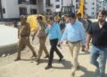 Dr Karwani inspects construction work in Transit accommodations for PM Package Employees